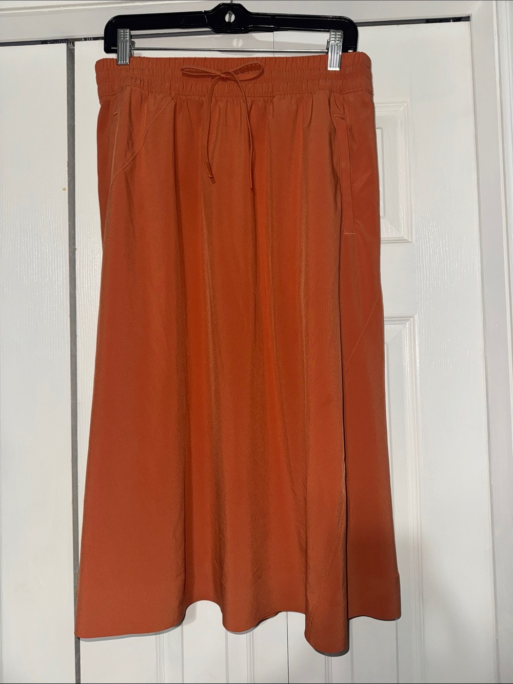 Athleta orange midi skirt elastic drawstring waist zipper pockets 12 like new